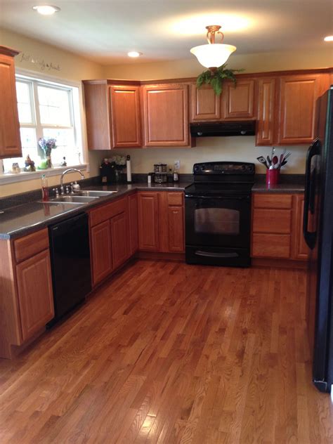 oak cabinets with black steel appliances|two tone oak kitchen cabinets.